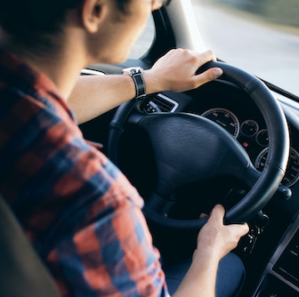 Person driving a car